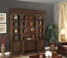 a living room filled with furniture next to a window