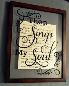 there is a framed paper with the words, then sings my soul