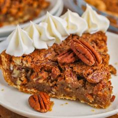 a slice of pecan pie with whipped cream on top