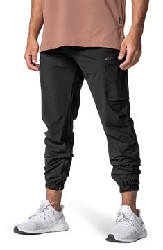 Lightweight, stretchy and ready to conquer the elements, these water-repellent joggers sport a comfortable fit and adjustable, easy-on zippers at the ankles. They come with secure pockets for holding your keys, cash, phone and energy gels as you run or work out. 28" inseam; 9" leg opening; 12" front rise; 15" back rise (size Medium) TETRA-LITE fabric offers lots of stretch plus durable water-repellent (DWR) protection against the elements. 76% nylon, 24% spandex Machine wash, line dry Imported Sports Stretch Nylon Cargo Pants, Breathable Functional Cargo Pants For Outdoor, Stretch Nylon Cargo Pants For Sports, Nylon Athleisure Pants With Functional Drawstring, Nylon Sweatpants With Side Pockets For Jogging, Breathable Sporty Cargo Pants For Sports, Sporty Breathable Cargo Pants For Sports, Athleisure Nylon Cargo Pants With Moisture-wicking, Sporty Stretch Cargo Pants With Functional Drawstring