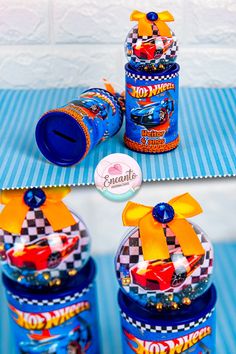 three blue candy jars with cars on them