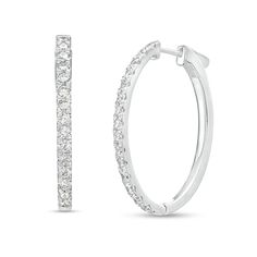 Satisfy your desire for sparkle with these elegant diamond oval-shaped hoop earrings, a smart choice for casual or formal occasions. Fashioned in 14K white gold Each oval-shaped hoop shimmers with diamonds along the front edge. These 2 ct. t.w. diamond earrings secure with hinged backs. Oval Diamond Hoop Earrings, Elegant Oval Hoop Earrings With Halo Design, Oval Diamond White Hoop Earrings Fine Jewelry, Oval Diamond Hoop Earrings In White Gold, White Gold Diamond Hoop Earrings With Oval Shape, Diamond White Oval Hoop Earrings For Formal Occasions, Oval Diamond Hoop Earrings With Diamond Accents, White Gold Oval Diamond Hoop Earrings, Oval Brilliant Cut Hoop Earrings For Formal Events