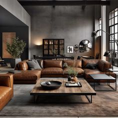 a living room filled with lots of brown furniture and large windows in the wall behind it