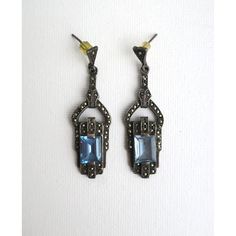 A beautiful pair of blue aquamarine gemstone and sterling silver drop earrings in the Art Deco style, circa late-20th century. Earrings are for pierced ears. Very Good condition as shown in images. No issues. Marked '925' for sterling silver on back of both as shown in last image. A beautiful pair to dress up or down. Dimensions: 1.88" Long Vintage Sterling Silver Earrings With 17 Jewels, Art Deco Blue Drop Earrings, Vintage Gemstone Earrings For Formal Occasions, Blue Art Deco Drop Earrings, Ornate Blue Pierced Earrings, Art Deco Silver Gemstone Earrings, Silver Art Deco Gemstone Earrings, Silver Gemstone Art Deco Earrings, Art Deco Pierced Earrings For Formal Occasions