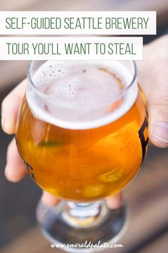 someone holding a beer in their hand with the caption self - guided seattle brewery tour you'll want to steal