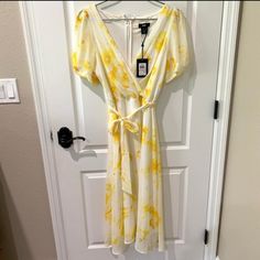 Dkny Chiffon Dress. White With Yellow Floral Design Chiffon Wrap Dress With Puff Sleeves. Waist Belt. Fully Lined Interior. Perfect Dress For Spring Or Summer To Wear With Flats, Sandals Or Heels. Color: White And Yellow Material: Chiffon Size: Us 6 Condition: Nwt Terms: Will Ship Within The Us Only. No Checks. No Personal Pick Up Available. No Transactions Via Email. Transactions Via Poshmark Only Will Be Accepted. Spring Yellow Chiffon Midi Dress, Yellow Chiffon Dress For Day Out, Yellow Chiffon Maxi Dress For Brunch, Chiffon Wrap Dress, Dkny Dress, Dress With Puff Sleeves, Chiffon Wrap, Sporty Dress, Midi Shift Dress