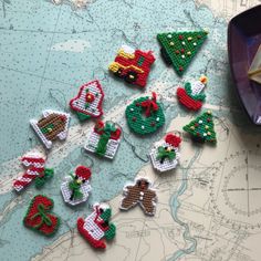 christmas ornaments are laid out on a map to be sewn - stitched together