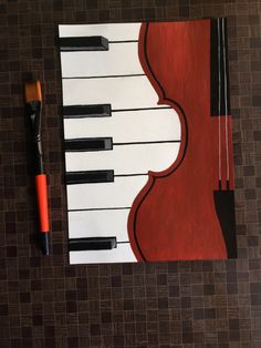 a painting of a red violin with black and white stripes on it next to a brush