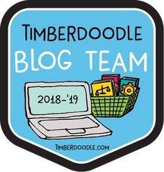 a laptop computer sitting on top of a blue badge with the words timberdale blog team