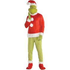 a man dressed as the grinch is talking on his cell phone while wearing a santa hat and green pants