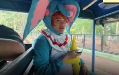 a person in a costume on a bus