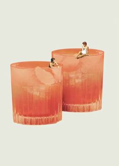 two orange vases sitting next to each other