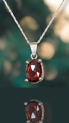 Indulge in the timeless beauty of this Rose-Cut Garnet Necklace, featuring a richly hued gemstone known for its deep red allure. Set in fine sterling silver, this January birthstone pendant exudes elegance with its classic cut and sophisticated charm. Perfect for both casual and formal occasions, this piece adds a touch of refined grace to any ensemble. ✳︎Material: High Quality Solid 925 Sterling Silver & Natural Garnet  ✳︎Width: 9mm ✳︎High:21mm  ✳︎Gemstone Color: Red  ✳︎Gemstone Size: 12×8mm ✳︎Chain: Solid 925 Sterling Silver ♡Shipping & Packaging♡ Items in stock will be shipped within 2 business days.  For custom orders, please allow one to two weeks for production before shipping.  All pieces will be shipped in a beautifully wrapped box. Certainly, they are also perfect for gifting. ♡Ou Red Garnet Oval Pendant Necklace, Red Gemstone Birthstone Necklace Gift, Ruby Oval Pendant Necklace For Gift, Red Gemstone Birthstone Necklace In Sterling Silver, Garnet Oval Pendant Necklace As A Gift, Red Sterling Silver Necklaces For Birthday, Garnet Pendant, Garnet Necklace, Shipping Packaging