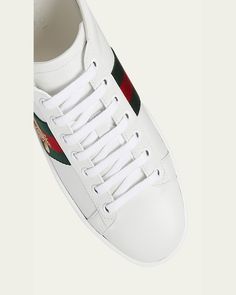 Gucci leather sneaker with bee embroidery at green/red/green webbing.    0.3" flat heel with platform.    Round toe.    Laceup vamp.    Metallic logo backstay.    Padded footbed.    Rubber outsole.    Made in Italy. Gucci Designer Platform Sneakers With Round Toe, Designer Gucci Platform Sneakers With Round Toe, Gucci Low-top Platform Sneakers With Branded Insole, Gucci Leather Low-top Platform Sneakers, Casual Gucci Platform Sneakers With Round Toe, Gucci Leather Platform Sneakers, Gucci Custom Lace-up Sneakers With Embroidered Logo, Gucci Custom Low-top Sneakers With Embroidered Logo, Custom Gucci Low-top Sneakers With Embroidered Logo