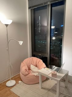 a living room with a large window and a bean bag chair