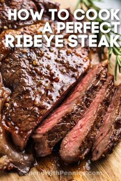 sliced steak on a cutting board with rosemary garnish