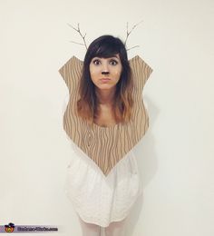 an instagramted photo of a woman with fake antlers on her head and the caption'taxidermy deer costume '