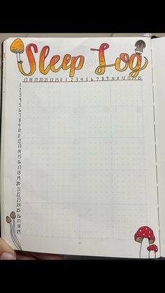 a hand holding an open notebook with the words sleep loop written in chinese on it