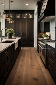 a large kitchen with dark wood cabinets and white counter tops, along with stainless steel appliances