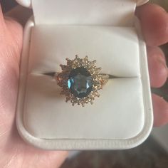 Gorgeous 14k Gold And Blue Sapphire Center Stone. Diamonds On The Outside. Never Worn, In Original White Leather Ring Box With Ravello Signage And White Box. Would Make Excellent Gift As New And All Intact Casings. Got This From My Mom. Looks Very Exquisite And Expensive, Quality. Added Pics Form Website To See The Brand/Qualities. Please Look Up Ravello Beverly Hills For Info On The Brand. Gold Topaz Ring With Halo Setting In 14k Gold, Formal Sapphire Ring With Princess Cut And Accent Stones, Formal 14k Gold Baguette Cut Topaz Ring, Sapphire Cluster Ring With Accent Stones For Formal Occasions, Sapphire Cluster Ring With Accent Stones For Formal Events, Formal Baguette Cut Topaz Ring In 14k Gold, Yellow Gold Sapphire Topaz Ring With Halo Setting, Gold Topaz Ring With Halo Setting, Sapphire Cluster Ring For Formal Occasions