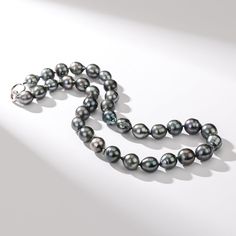 Experience the mysterious allure of the ocean with our Tahitian South Sea Baroque Pearl Strand Necklace. The AA+ quality guarantees uniqueness in each Baroque pearl, offering an unparalleled lustrous sheen. Embrace the natural, irregular beauty of these exotic pearls, and make a bold and sophisticated statement. Ideal for those looking to add an extraordinary touch to their jewelry collection. Necklace Length: 18'' (45cm). 20" (51cm), 22" (56cm), 24"(61cm) Product Information Pearl Type Tahitian Luxury Pearl Necklace With Round Gemstone Beads, Luxury Tahitian Pearl Necklace With Pearl Charm, Luxury Pearl Necklace With Polished Beads, Luxury Tahitian Pearl Necklace With Round Beads, Luxury Silver Tahitian Pearl Necklace, Luxury Tahitian Pearl Silver Necklace, Luxury Akoya Pearl Gemstone Necklace, Luxury Tahitian Pearl Necklace, Baroque Pearls Necklace