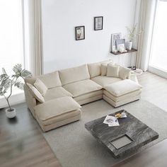 a living room with a sectional couch and coffee table