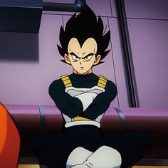 an anime character sitting on the ground with his arms crossed