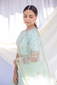 Pastel Blue Lehenga Transitional Blue Lehenga With Mirror Work, Kundan Choli For Eid, Festive Choli With Sheer Dupatta For Transitional Season, Blue Kundan Sets With Mirror Work, Blue Kundan Saree, Fitted Gota Work Choli For Eid, Fitted Salwar Kameez With Gota Work For Reception, Blue Lengha Choli, Modern Lengha