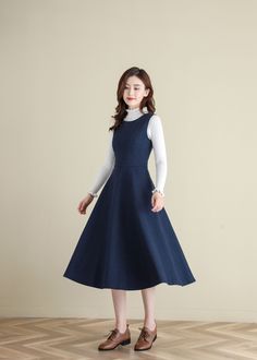 "★★ FEATURES * wool blend * Two side seam pockets * Back zipper closure * Sleeveless * High waistband * Full circle dress A Line Dress, * Perfect for Winter, autumn * Dry clean ★★ The model is 170 cm (5′ 7″) tall with a 80 cm (31.5\") bust, 66 cm (26\") waist. She is wearing the swing wool dress in size XS. ★★ Please select custom order according to the follow situation Your height is not between 155 cm- 172 cm Your weight is over 75 kg Request the length ★★ Get your size in Size Chart with your Wool Dress Winter, Womens Pinafore Dress, Pinafore Dress Outfit, Medieval Outfits, Midi Pinafore Dress, 1980s Outfits, Diy Fashion No Sew, Disney Jacket, Woolen Dresses