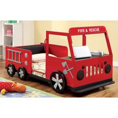 a child's fire truck bed is shown