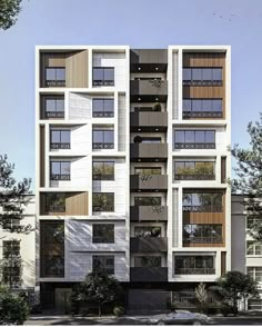 an apartment building with many windows and balconies on the top floor is shown