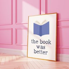 a book was better sign in front of a pink wall with wooden floor and paneled doors