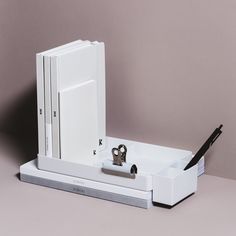 a pair of scissors sits on top of a white box