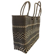 Oaxaca tote Bag, Handmade Mexican Bag, Getaways bag, Travel Bag, Basket, Beach Bag,vegan bag ,Plastic Woven, Oaxaca Bag, recycled plasticThe specifics are impressive: the bag is woven from a heavy duty, pliable plastic that is near indestructible. The weave is so tight, the bag is waterproof, which alone makes it uniqueApproximate measurements.13.5 h x 17 w x 5.5 d34 x 43 cmPlease note, since this piece is made by hand there may be some imperfections. Instead of viewing this as a mistake, let it Eco-friendly Black Woven Shoulder Bag, Eco-friendly Black Tote Beach Bag, Large Woven Vacation Bag, Eco-friendly Black Bags With Braided Handles, Eco-friendly Black Tote Bucket Bag, Large Woven Bag For Vacation, Black Handwoven Beach Bag For Daily Use, Large Eco-friendly Bags With Braided Handles, Eco-friendly Rectangular Black Bucket Bag