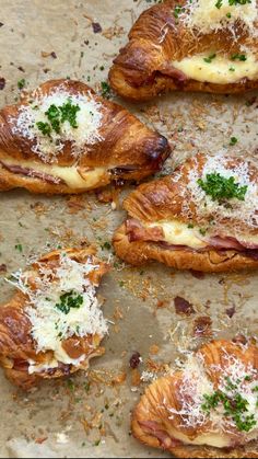 several pastries with cheese and parmesan on top