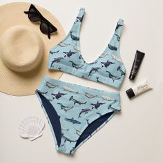 Make a splash all summer long with this one of a kind sustainable "Nautical Wahle & Hammerhead Shark High Waisted" bikini set. Enjoy the smooth fabric and the flattering design, and show it off at the beach or by the pool! Removable pads and its double-layer make it comfy to wear all day by the pool or beach. It's made from soft recycled polyester with double-layering and UPF 50+. * Soft and stretchy material with UPF 50+ * Sizes up to 6XL * Bikini top comes with removable padding for comfort * Shark Bathing Suit, Beachy Triangle Top Swimwear With Uv Protection, Printed Swimwear For Surfing, Printed Beachwear For Surfing, Summer Swimwear For Surfing Vacation, Printed Triangle Top Swimwear For Surfing, Vacation Surfing Beachwear Swimwear, Blue Swimwear For Surfing Beach Season, Blue Swimwear For Surfing And Beach Season