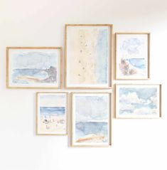 six watercolor paintings hang on the wall