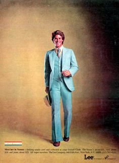 a man in a blue suit and tie is posing for a magazine cover with his hands in his pockets