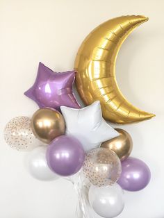 balloons and stars are arranged in the shape of a crescent, moon, and star