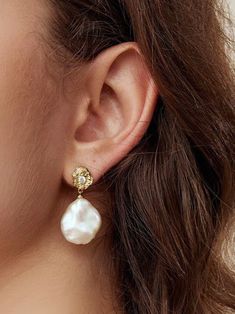 Adorn yourself with a pair of French Lava Petal Baroque Pearl Drop Earrings for an elegant look. Each earring features a unique lava design set on a sterling silver post and adorned with dazzling baroque pearls, creating a captivating contrast of textures and shapes. The design exudes sophistication and glamour, making these earrings perfect for casual outings and formal occasions. Metal: 18K Recycled Gold Plated Vermeil on Recycled Sterling Silver/Recycled Sterling Silver Pearl: Petal Baroque P Cubic Zirconia Earrings, Zirconia Earrings, Pearl Gemstone, Recycled Gold, Design Set, Recycled Sterling Silver, Pearl Drop Earrings, Silver Pearls, Pearl Drop