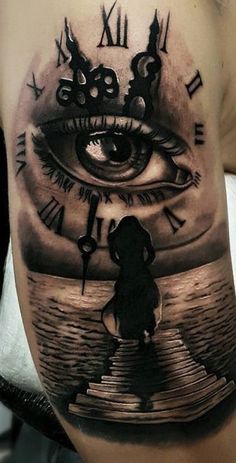 a man's arm with an eye and clock on it