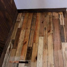 the floor is made out of wood planks and has been stripped off with paint