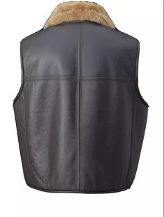 Warm and rugged vest made from genuine shearling and sheepskin leather, perfect for those who value comfort and a classic aviator-inspired look. Free shipping on all leather vests. Made from 100% genuine sheepskin leather, ensuring durability and premium quality. Lined with real natural sheep fur for maximum warmth and comfort. Features 2 exterior pockets and 1 interior pocket for convenient storage. One-way zipper closure for easy wear and secure fit. Designed with a classic shirt collar style. Requires dry cleaning by a leather specialist to maintain quality. Handmade with attention to detail, ensuring a unique and high-quality finish. Offers exceptional warmth, ideal for extreme cold conditions. Custom sizing available at no extra cost if your size is not in the chart; receive a genuine Formal Shirts Women, Sheepskin Vest, Short Leather Skirts, Brindle Cowhide, Mens Leather Pants, Leather Waist Bag, Leather Toiletry Bag, Real Leather Bags, Cowhide Rugs