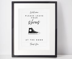 a black and white poster with the words welcome please leave your shoes at the door