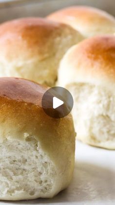 rolls sitting on top of a white plate