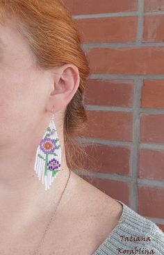 These handmade unique earrings with abstract floral print are made of high-quality Czech beads and strong synthetic thread. I use my author's scheme . They are elegant, fashionable, and highly versatile, suitable for everyday wear. Color: white,pink,purple,red,orange, green . 100% hand made with love! I beg you not to copy my authoring Copy without my permission is prohibited For those who want to buy my copyright scheme for these earrings: https://www.etsy.com/uk/listing/974991392/brick-stitch- White Flower-shaped Jewelry With Dangling Beads, White Beaded Earrings For Summer, White Beaded Earrings For Summer Gift, Summer White Beaded Earrings For Gift, Summer White Beaded Earrings Gift, Summer White Flower Earrings With Colorful Beads, Handmade White Jewelry For Summer, White Handmade Adjustable Earrings, White Dangle Flower Earrings With Colorful Beads