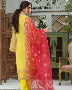 Embroidered Yellow Organza Salwar Kameez Pakistani Dresses makes a fashion-forward style statement in this contemporary and flattering silhouette! The yellow salwar kameez is a classic ensemble in gold dust and fully encrusted with glittering crystalline filigree. It is layered over a cotton silk slip and flared culottes and paired with a diaphanous dupatta. Detailed Description: SKU: PN648 Detailing: Beads, Pearls, Embroidery, Sequins, Motifs Color: Yellow Fabric: Net, Organza Design: Fully Emb Organza Salwar, Salwar Kameez Pakistani, Pakistani Suits Online, Organza Top, Gold Dust, Design Studios, Silk Slip, Fabric Stores Online, Designer Suits