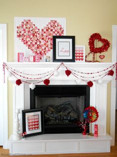 a fireplace decorated for valentine's day with red and white decorations