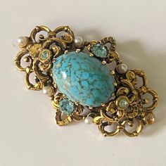 Vintage filigree brooch with a cabochon imitating turquoise. Add this vintage  brooch to your jean jackets,t-shirts,hats,totes more.  This pin makes a great gift.  Size 3 cm x 5 сm          1.2  in x 2 in I'm always happy to combine multiple items to save on shipping,just ask! International Buyers Attention! Please be aware that there may be VAT, import or customs fees in your country. These fees are your responsibility and I may not be aware of the fees for each country. Please contact your loc Turquoise Cabochon Brooch As A Gift, Turquoise Brooch Jewelry Gift, Luxury Turquoise Brooches For Gift, Elegant Turquoise Brooches For Collectors, Handmade Turquoise Brooches For Collectible, Turquoise Cabochon Brooch For Gift, Vintage Blue Brooch Pin, Antique Handmade Blue Brooches, Handmade Vintage Turquoise Brooches