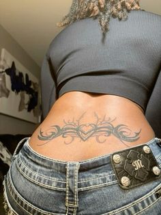 a woman with a tattoo on her stomach